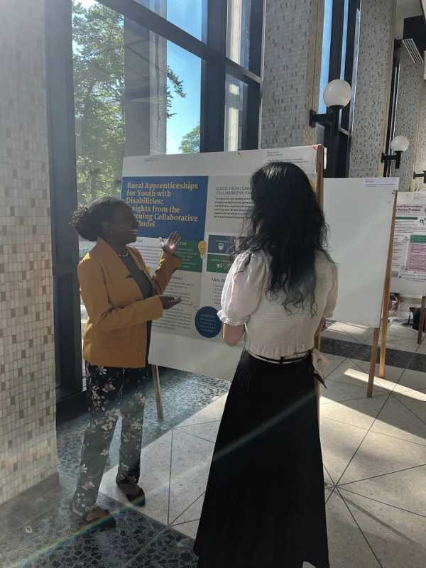 Photo of DeBrittany (Mitchell) Humphrey presenting her poster: “Rural Apprenticeships for Youth with Disabilities: Insights from the Learning Collaborative KT Model”